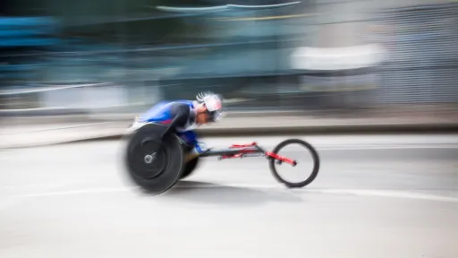 Man racing in wheelchair